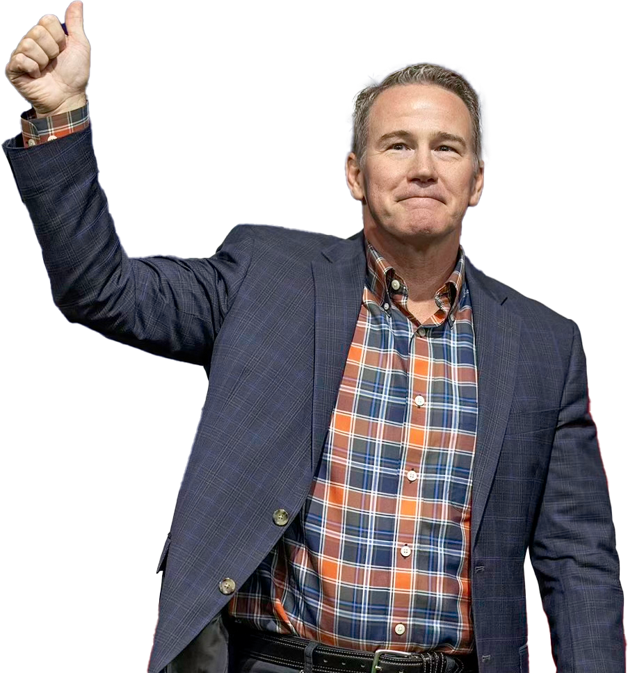 Senator Jon Husted giving a thumbs up in front of the American flag