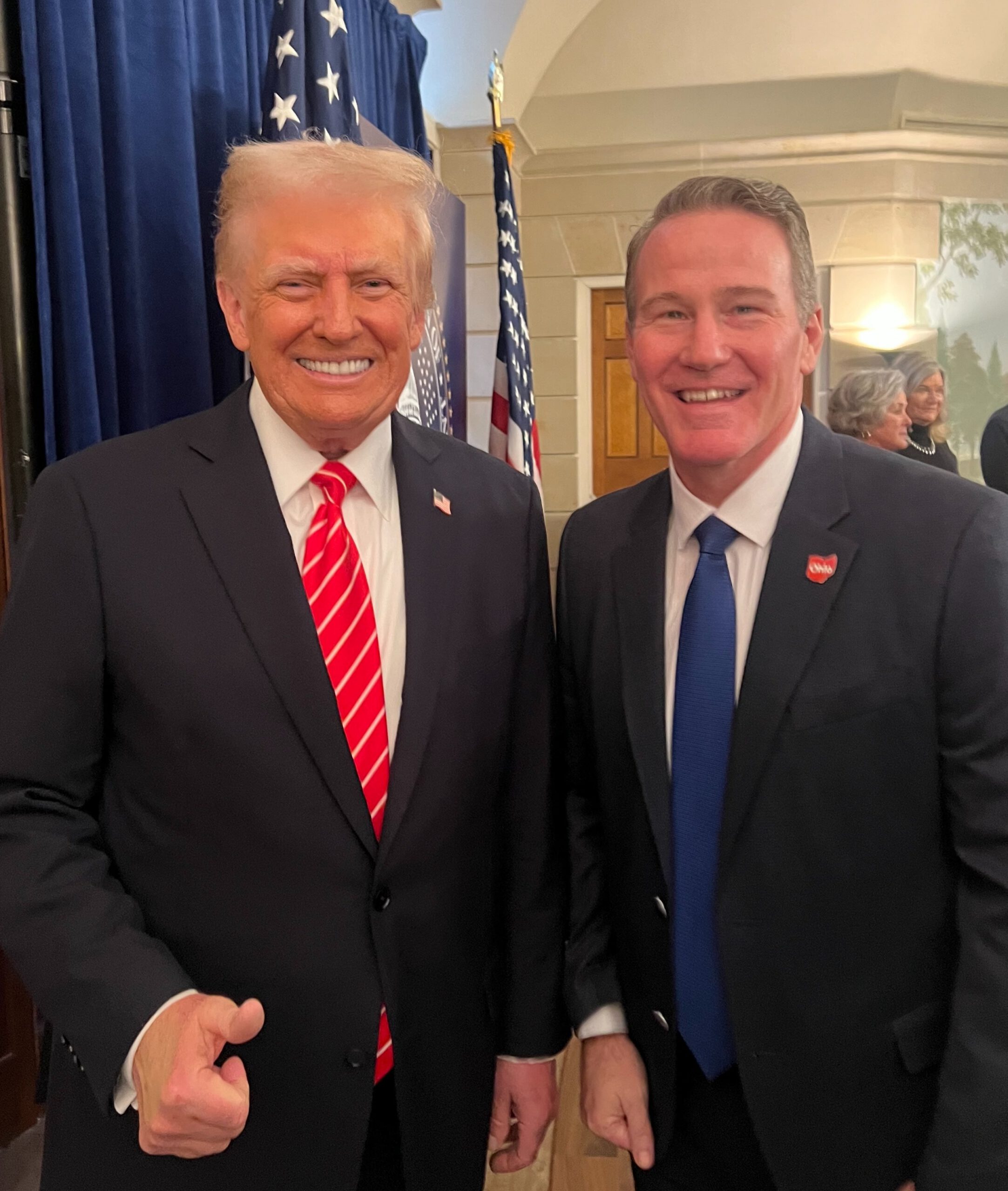 President Donald Trump putting his hand on Senator Jon Husted’s shoulder